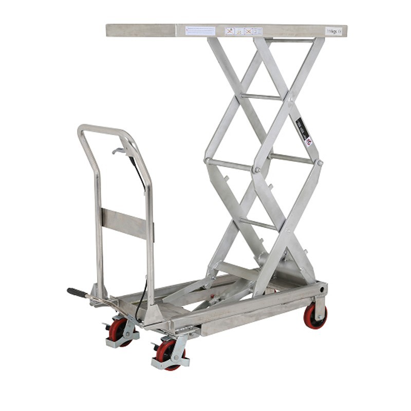 Vista desde 3/4 con plataforma alta de la mesa elevadora INOX 304 doble tijera